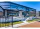 Relaxing backyard with a white stucco exterior, tile roof, and access to outdoor living and lounging on the wooden deck at 510 16Th E Ave, Palmetto, FL 34221