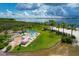 Aerial view of a community beach with seating and picnic tables for resident enjoyment at 510 16Th E Ave, Palmetto, FL 34221