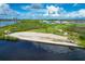 A scenic beach with kayaks, a beach volleyball area, and picnic spot for residents at 510 16Th E Ave, Palmetto, FL 34221