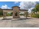 A beautiful stone community entrance with a covered entry offers a sense of arrival at 510 16Th E Ave, Palmetto, FL 34221