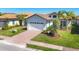 Charming one-story home with a brick driveway, two car garage, and well-manicured landscaping at 510 16Th E Ave, Palmetto, FL 34221