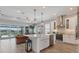 Open-concept kitchen with an island, stainless steel appliances, and a view of the living area at 510 16Th E Ave, Palmetto, FL 34221