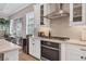 Well-lit kitchen with stainless steel appliances, white cabinets, and modern design at 510 16Th E Ave, Palmetto, FL 34221