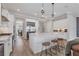 Modern kitchen with white cabinetry, stainless steel appliances, and a central island with seating at 510 16Th E Ave, Palmetto, FL 34221