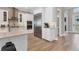 Close-up of the kitchen featuring stainless steel appliances and white cabinets at 510 16Th E Ave, Palmetto, FL 34221