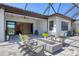 Cozy outdoor lanai with comfortable seating near a fire pit, offering seamless indoor-outdoor living at 510 16Th E Ave, Palmetto, FL 34221