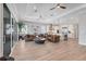 Spacious living room with light wood floors, modern decor, and seamless flow to the kitchen at 510 16Th E Ave, Palmetto, FL 34221