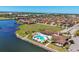 Overhead view of pool, clubhouse, and surrounding community with a waterfront view at 510 16Th E Ave, Palmetto, FL 34221