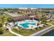 A captivating aerial view of the pool, clubhouse, and surrounding community at 510 16Th E Ave, Palmetto, FL 34221