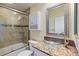 Bathroom featuring glass bowl sink, large mirror, and shower/tub combo at 5319 Levi Ln, Sarasota, FL 34233