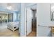 View from hallway of bathroom featuring tiled shower and neutral walls at 5319 Levi Ln, Sarasota, FL 34233