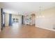 Spacious living room with tile floors, television and sliding glass doors to the sun room and pool area at 5319 Levi Ln, Sarasota, FL 34233