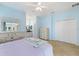 Bright bedroom featuring ensuite bathroom, neutral carpet, and closet at 5319 Levi Ln, Sarasota, FL 34233