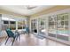 Enclosed sun room with tile floors, ceiling fan and view of the pool at 5319 Levi Ln, Sarasota, FL 34233