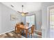 Dining room featuring modern flooring, and a window overlooking the yard at 5330 Alseir Rd, North Port, FL 34288