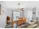 Bright dining area featuring a ceiling fan, modern flooring and natural light at 5330 Alseir Rd, North Port, FL 34288
