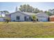 Single Gathering home boasting a well-manicured lawn and a welcoming facade at 5330 Alseir Rd, North Port, FL 34288
