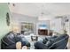 Spacious living room with lots of seating, ceiling fan, and lanai access at 5330 Alseir Rd, North Port, FL 34288