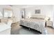 Bright main bedroom with a view to the dining area, offering a desk and dressers at 5330 Alseir Rd, North Port, FL 34288