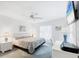 Sunlit bedroom offering a television, a desk space, and neutral decor at 5330 Alseir Rd, North Port, FL 34288