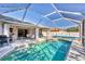 Inviting screened-in pool area with clear blue water, lounge chairs, and ample space for outdoor relaxation at 5330 Alseir Rd, North Port, FL 34288