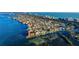 Expansive aerial view of luxurious waterfront homes, showcasing lush landscapes, coastal charm, and tranquil waterways at 537 Gunwale Ln, Longboat Key, FL 34228