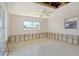 Bedroom with two windows showing walls stripped down to structural studs ready to customize as you like at 537 Gunwale Ln, Longboat Key, FL 34228