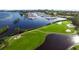 Picturesque view of a manicured golf course and marina, showcasing premier waterfront and recreational amenities at 537 Gunwale Ln, Longboat Key, FL 34228