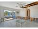 A living room under renovation with sliding glass doors to the outside pool at 537 Gunwale Ln, Longboat Key, FL 34228