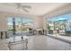 A living room under renovation with sliding doors to the pool and backyard at 537 Gunwale Ln, Longboat Key, FL 34228