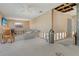 Shows damage in a living room, where the drywall has been removed and the structure of the home is visible at 537 Gunwale Ln, Longboat Key, FL 34228