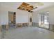 An open concept living room under renovation with partial walls and an exterior view at 537 Gunwale Ln, Longboat Key, FL 34228