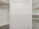 Walk-in closet with white storage, lots of shelving, and space for hanging clothing at 555 Park Estates Sq, Venice, FL 34293