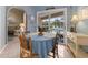 Charming dining area with pool views offers a bright and relaxing space for meals at 555 Park Estates Sq, Venice, FL 34293