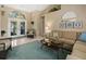 Stylish living room with high ceilings, comfortable seating, and natural light creating a welcoming space at 555 Park Estates Sq, Venice, FL 34293