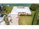 Beautiful single-story home featuring a white exterior, well-manicured lawn, and a spacious driveway at 600 Mourning Dove Dr, Sarasota, FL 34236