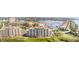 Beautiful aerial view highlighting the condo building, marina, and waterfront surroundings at 615 Riviera Dunes Way # 208, Palmetto, FL 34221