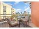 Relax on this condo balcony with seating and serene views of the city skyline and waterfront at 615 Riviera Dunes Way # 208, Palmetto, FL 34221