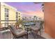 Relax on this condo balcony with seating and serene views of the city skyline and waterfront at 615 Riviera Dunes Way # 208, Palmetto, FL 34221