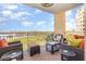 Spacious balcony with comfortable seating and scenic views of the water and surrounding landscape at 615 Riviera Dunes Way # 208, Palmetto, FL 34221