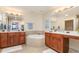 Bathroom with double sink vanity, soaking tub and tile floors at 615 Riviera Dunes Way # 208, Palmetto, FL 34221