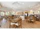 Spacious clubhouse with kitchen, dining tables, and comfortable seating areas at 615 Riviera Dunes Way # 208, Palmetto, FL 34221