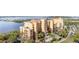 Condo building with balconies and palm trees, showcasing the coastal lifestyle at 615 Riviera Dunes Way # 208, Palmetto, FL 34221