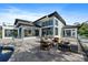Spacious backyard patio with a modern outdoor seating arrangement at 6178 9Th Avenue Ne Cir, Bradenton, FL 34212