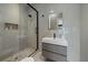 Modern bathroom with glass shower, sleek vanity, and neutral tile finishes at 6178 9Th Avenue Ne Cir, Bradenton, FL 34212