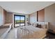 Bedroom with light coloured walls, a modern desk, and view from balcony at 6178 9Th Avenue Ne Cir, Bradenton, FL 34212