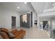 Bright hallway with sleek tile floors, modern staircase, and stylish built-in storage at 6178 9Th Avenue Ne Cir, Bradenton, FL 34212