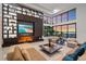 Modern living room with large windows, built-in shelves, a fireplace, and a comfortable seating arrangement at 6178 9Th Avenue Ne Cir, Bradenton, FL 34212