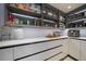 Well-organized pantry with sleek gray shelving, white countertop, and ample storage space at 6178 9Th Avenue Ne Cir, Bradenton, FL 34212