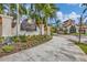 Elegant entrance to Legends Bay showcases lush landscaping and architectural details of the community at 6211 Legends Blvd, Bradenton, FL 34210
